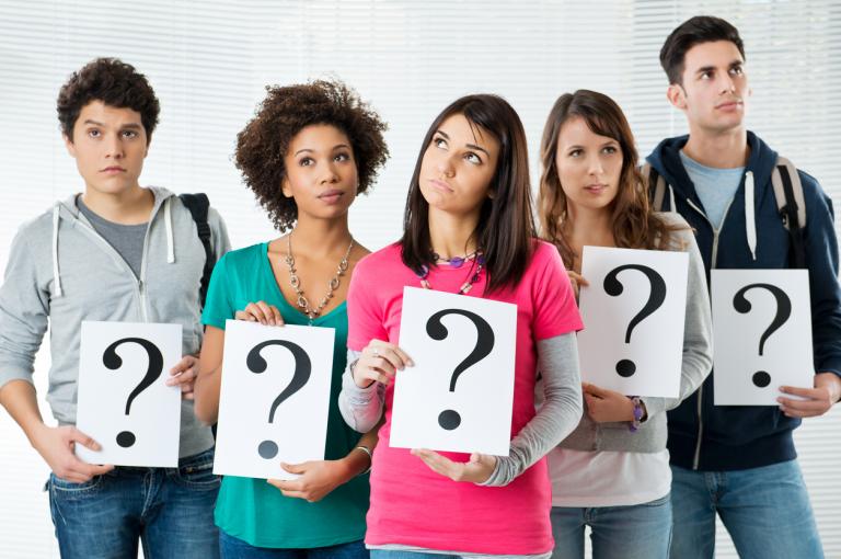 group-of-highschool-students-holding-paper-with-question-mark-while-thinking-about-their-future-career