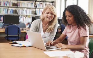 Student Has personalized mentoring From Teacher In Library