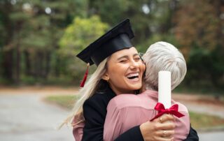 a girl hugging her mother after graduating early from high school