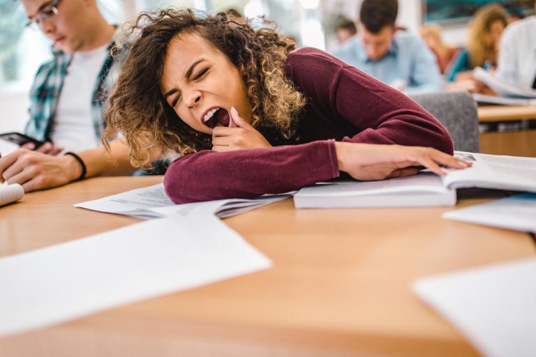 Students yawning in the classroom.