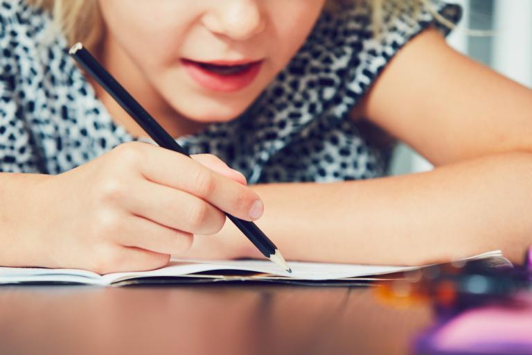 Little girl taking a learning disabilities test