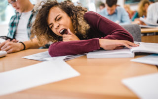 Students yawning in the classroom.