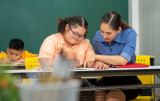 A child learning under the IEPs and 504 Plans as a disabled student.