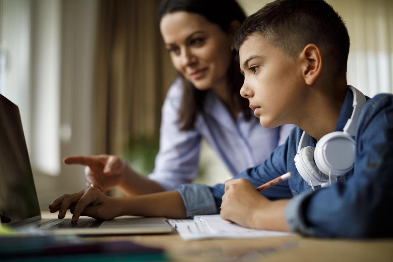 Mother helping teenager get ready for back to school
