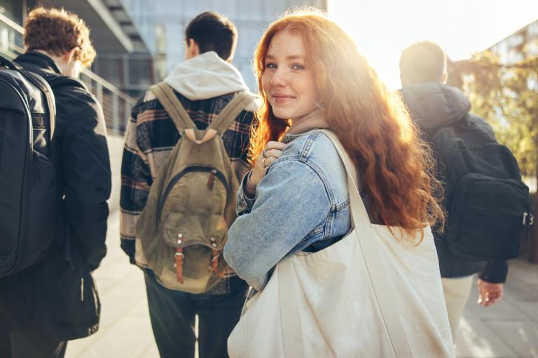 female-student-with-her-friends-going-to-traditional-school