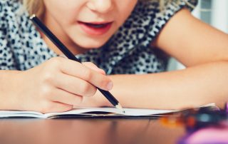 Little girl taking a learning disabilities test