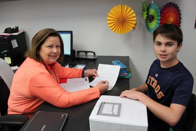 Teacher helping student with study skills