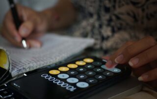 A student using a phone calculator for homework. Are calculators helping or hurting the student's academic development.