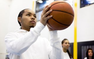 Basketball player focusing on taking a penalty shot in high school sports