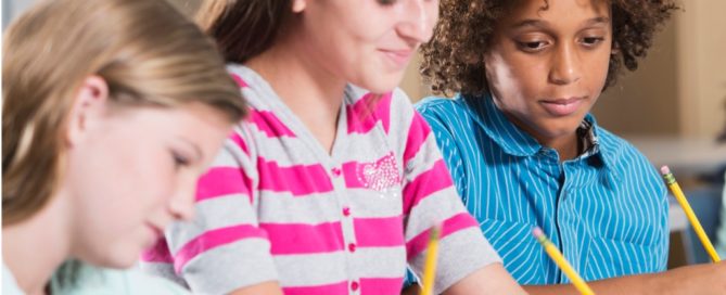 Multiethnic students writing and dealing with dyslexia and dysgraphia