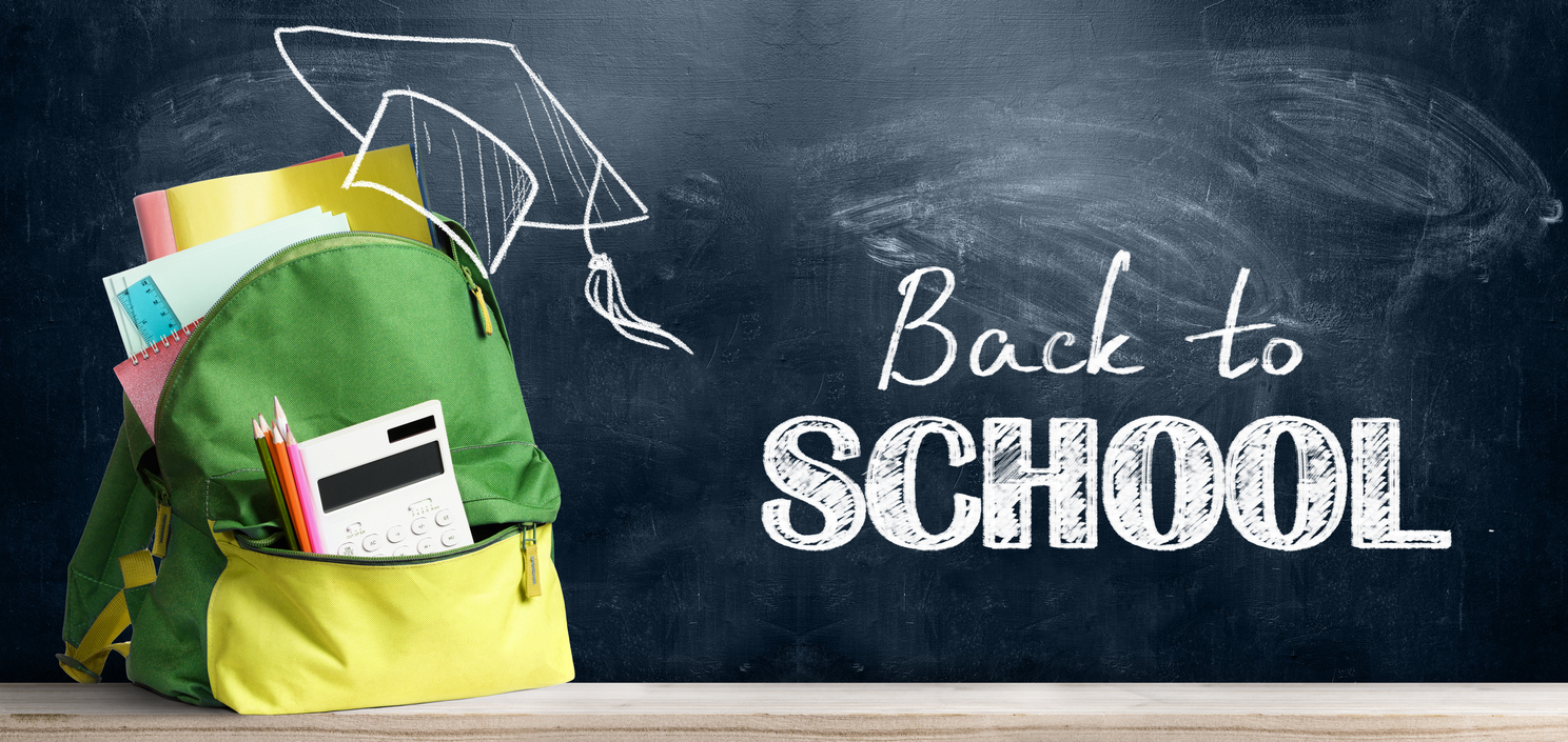 Back to school season shopping backpack. Accessories in student bag against chalkboard