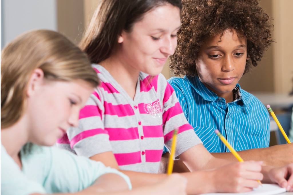 Multiethnic students writing and dealing with dyslexia and dysgraphia
