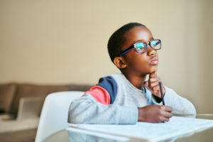 boy-thinking-while-doing-homework-critical-thinking