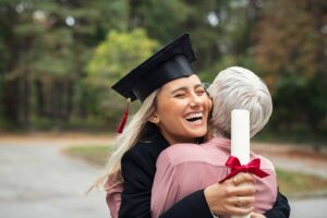 a girl hugging her mother after graduating early from high school
