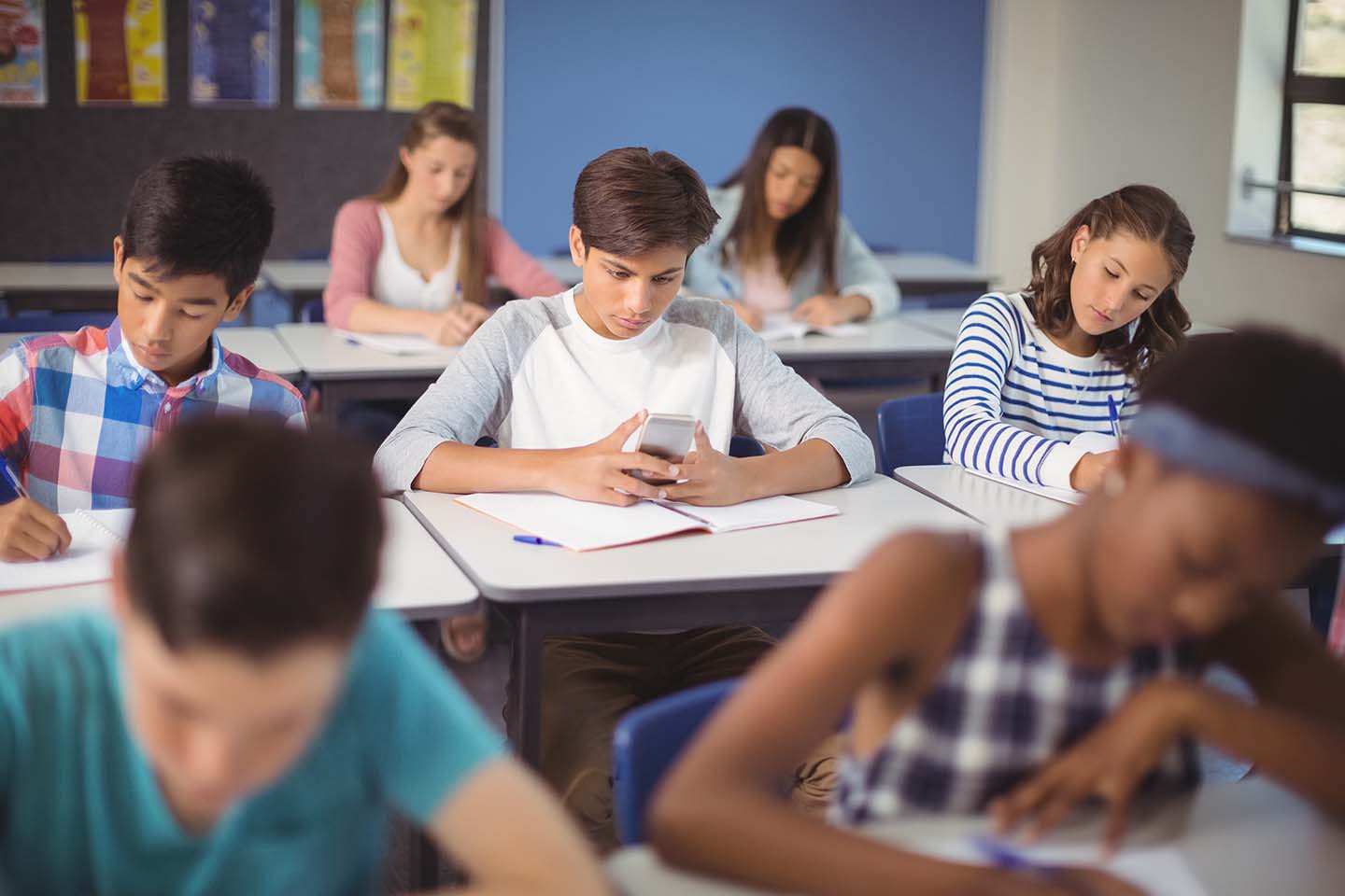 A student being allowed screen time in class.